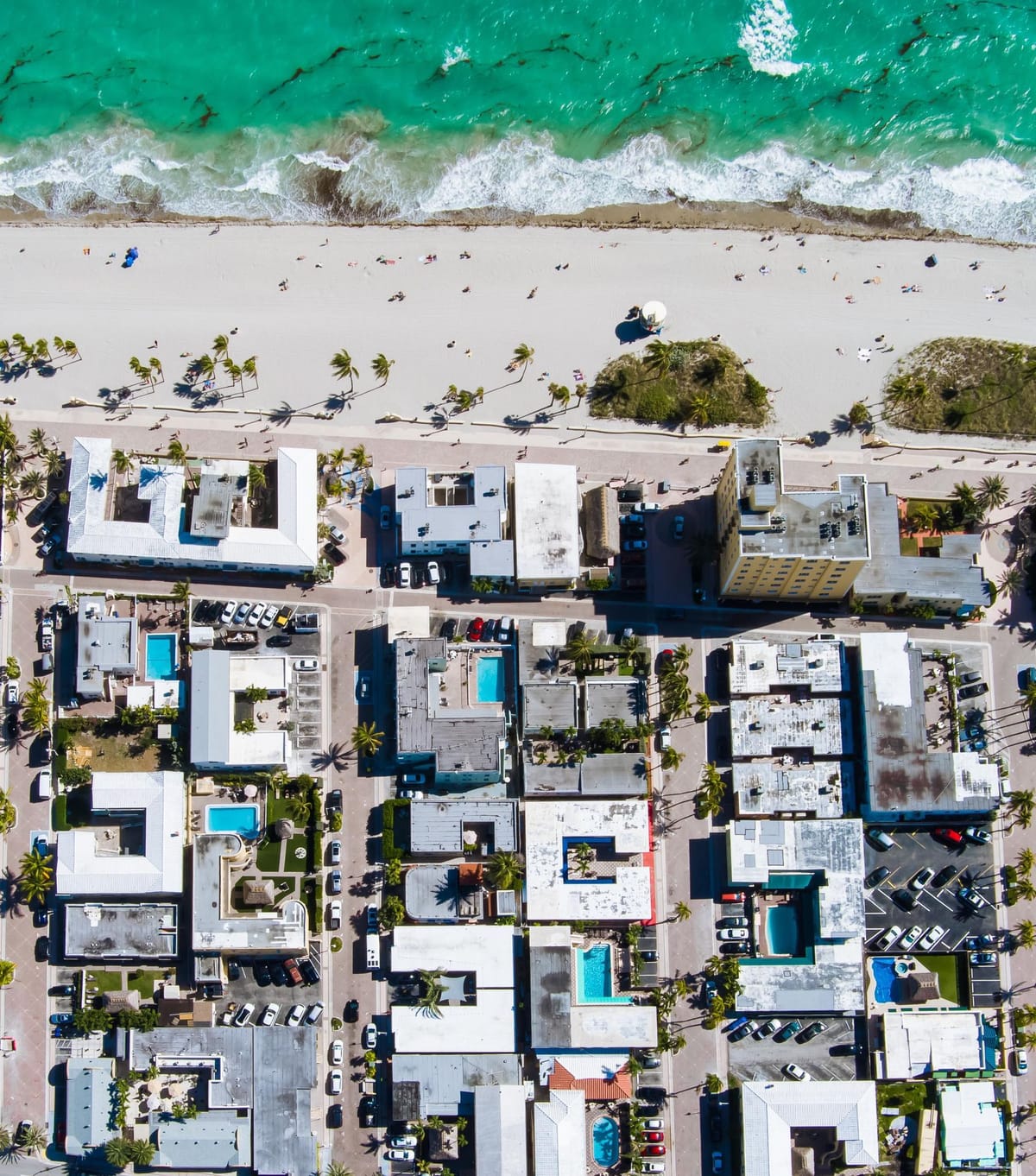 The 1900 block of North Ocean Drive from the air, the beach at the edge of the buildings